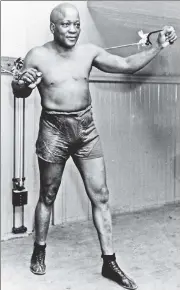  ??  ?? Clear his name: Jack Johnson, the first black heavyweigh­t boxing champion, in New York in 1932.