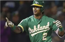  ??  ?? Oakland Athletics’ Khris Davis celebrates after hitting a walk-off home run in the 10th inning of a baseball game against the Minnesota Twins on Friday, in Oakland. AP PHOTO/BEN MARGOT