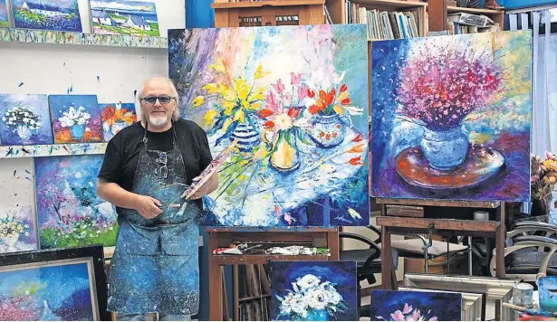  ?? ?? Creative talent Artist John Lowrie Morrison – known as ‘Jolomo’ – pictured with some of his work previously