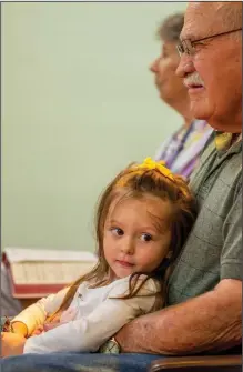  ??  ?? Paisley Eisenhower sits on the lap of her great-grandfathe­r, Don Trexler.