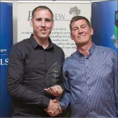  ??  ?? John Shay presents Mark Nolan of Arklow United with the Division 3 Manager of the Year award.