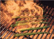  ?? Colter Peterson / TNS ?? Grilled Asparagus with Olive Oil and Parmesan