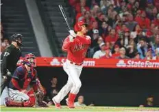  ?? USA Today Sports ?? ■ Los Angeles Angels’ Shohei Ohtani ( 17) follows through on a three- run home run in his first ever regular season MLB.