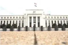  ??  ?? Photo shows the Federal Reserve building in Washington DC, US. Under the cloud of an escalating trade war, the US Federal Reserve this week will raise the benchmark lending rate for the third time this year, moving to prevent inflation from mounting too quickly as the world’s largest economy continues brisk growth. — Reuters photo