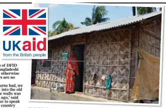  ??  ?? FLIMSY: Fahima at her home – a sign, above, shows it was built with UK aid