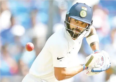  ?? — AFP photo ?? Indian cricket team captain Virat Kohli plays a shot on the third day of the second Test cricket match between India and Sri Lanka at the Vidarbha Cricket Associatio­n Stadium in Nagpur on November 26, 2017.