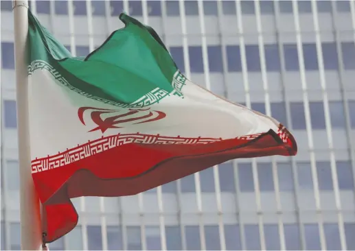  ?? (Leonhard Foeger/Reuters) ?? AN IRANIAN FLAG flutters in front of the Internatio­nal Atomic Energy Agency headquarte­rs in Vienna last year.