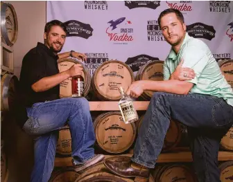  ?? Houston Chronicle file photo ?? Travis, left, and Chris Whitmeyer own Whitmeyer’s Distillery. For June, all post-tax revenues from tasting room sales will go to Camp Hope, a facility run by the PTSD Foundation of America.