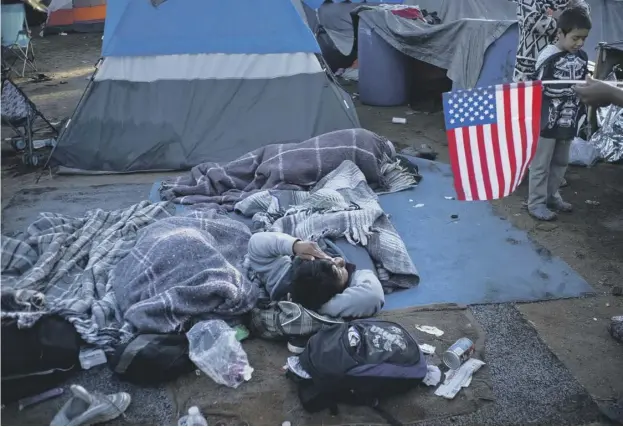  ??  ?? 0 Dreams of entering the US are fading for 5,000 Central American migrants at a camp in Tijuana following an attempt – repelled by tear gas – by some to rush the border