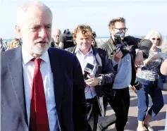  ??  ?? Corbyn leaves a temporary television studio after appearing on the BBC’s Andrew Marr Show, in Brighton. — Reuters photo