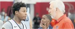  ?? JOHN LOCHER/THE ASSOCIATED PRESS ?? Kyle Lowry, left, wasn’t interested in discussing anything outside of Gregg Popovich’s U.S. basketball team, including if he’d chatted with Kawhi Leonard.