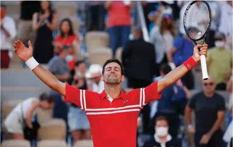  ?? | Gonzalo Fuentes REUTERS ?? SERBIA’S Novak Djokovic raises his hands in joy after winning this year’s French Open in Paris yesterday.