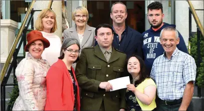  ?? Photo by Michelle Cooper Galvin ?? Brian Hickey presenting a donation to Martina McCarthy and Siobhan Looney for the Kerry Stars Special Olympics with Rosie Healy, Pat Looney (back from left) Donagh Moynihan, Sheila McCarthy, Aidan O’Connor and Oisin O’Mahony at The Malton, Killarney on...