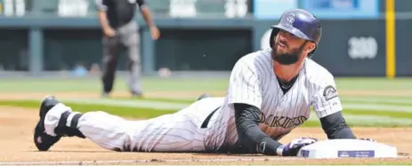  ?? Doug Pensinger, Getty Images ?? Charlie Blackmon, sliding into third with a triple April 9 against the White Sox, has been on base a lot this season.