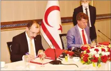  ??  ?? Turkey’s Trade Minister Mehmet Muş, left, and the TRNC’s Deputy PM and Economy and Energy Minister Erhan Arıklı inking the protocol