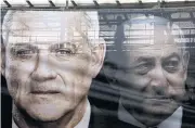  ??  ?? An election banner depicts Benny Gantz, leader of the Blue and White party, left, and Israeli Prime Minister Benjamin Netanyahu.