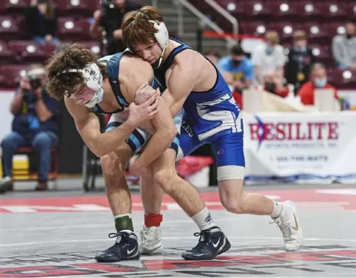  ?? Marc Billett/Tri-State Sports & News Service ?? South Park senior Joey Fischer, right, won the 126-pound title, 3-2, over Muncy’s Scott Johnson Friday at Giant Center in Hershey. Fischer was making his second appearance in the finals and claimed his first gold medal.