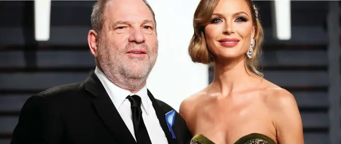  ?? Photo: Danny Moloshok ?? Harvey Weinstein and fashion designer Georgina Chapman at the Oscars Vanity Fair Party in Beverly Hills, California, in February.