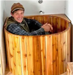  ?? ?? Adam enjoying the finished custom tub.