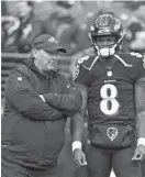  ?? KENNETH K. LAM/BALTIMORE SUN ?? Marty Mornhinweg, left, talks with quarterbac­k Lamar Jackson. Mornhinweg was coach John Harbaugh’s fifth offensive coordinato­r since taking over in 2008.