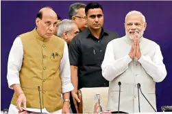  ??  ?? Pime Minister Narendra Modi with home minister Rajnath Singh at the fourth meeting of the Governing Council of Niti Aayog, in New Delhi on Sunday. — PTI