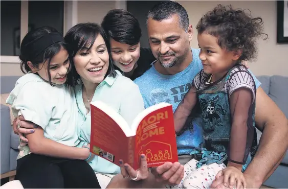  ?? Picture / Doug Sherring ?? Stacey and Scotty Morrison at home in Mt Albert, Auckland, with their children Kurawaka (left), Hawaiki and Maiana.