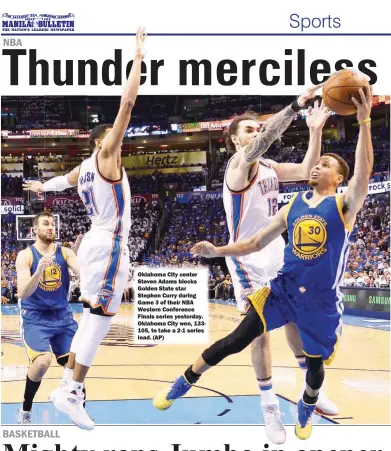  ??  ?? Oklahoma City center Steven Adams blocks Golden State star Stephen Curry during Game 3 of their NBA Western Conference Finals series yesterday. Oklahoma City won, 133105, to take a 2-1 series lead. (AP)