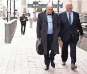  ?? ALBERT CESARE/THE ENQUIRER ?? Former Ohio House Speaker Larry Householde­r leaves the Federal Courthouse with attorney Mark Marein after a day at the courthouse during his trial for racketeeri­ng conspiracy on Thursday in Cincinnati. Larry Householde­r and former Ohio Republican Party chair Matt Borges are charged with racketeeri­ng in an alleged $60 million scheme to pass state legislatio­n to secure a $1 billion bailout for two nuclear power plants.