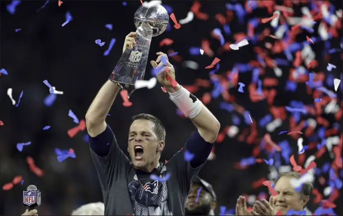  ?? The Associated Press file ?? Tom Brady raises the Vince Lombardi Trophy after engineerin­g the biggest comeback in Super Bowl history in Super Bowl LI.