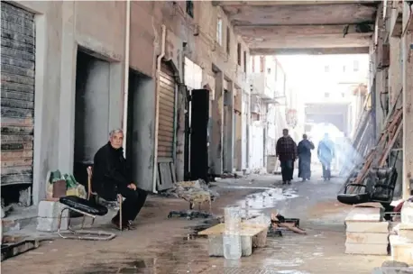  ??  ?? MEN restore their shops that were destroyed by war in an old popular market, known as the Souk al-Jureid, in Benghazi, Libya. | Esam Omran Al-Fetori Reuters African News Agency (ANA)