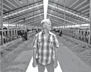  ?? KYLE GREEN/THE WASHINGTON POST ?? Bernie Teunissen, owner of Beranna Dairy, stands in a cow pen at his dairy farm in Caldwell, Idaho.