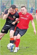  ?? ?? Tussle Andy Innes battles for possession in a competitiv­e encounter