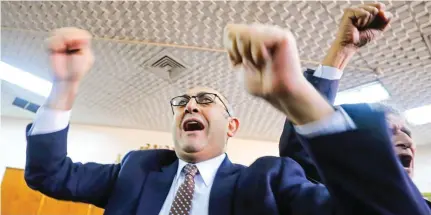  ?? – Reuters ?? JUBILANT: Egyptian lawyer and ex-presidenti­al candidate Khaled Ali shout slogans inside the State Council courthouse after a ruling against the Egypt-Saudi border demarcatio­n agreement, in Cairo, Egypt, on Monday.
