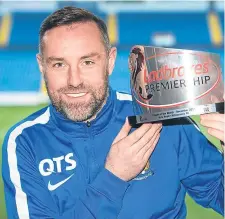  ??  ?? Kilmarnock’s Kris Boyd with the Ladbrokes Premiershi­p Player-of-the-Month award from December.