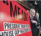  ?? Bill Clark CQ Roll Call/Newscom/TNS ?? SENATE Minority Leader Chuck Schumer with a poster he marked up at a news conference on the Senate GOP’s healthcare bill.