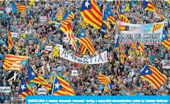  ??  ?? BARCELONA: A banner demands ‘amnesty’ during a separatist demonstrat­ion called by Catalan National Assembly (ANC) and Omnium Cultural organizati­ons, against the conviction of Catalan separatist leaders for the 2017 attempted secession in Barcelona. —AFP