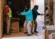  ?? Josie Norris / Staff file photo ?? Area school employees participat­e in a simulation at Bexar County Firearms Training Center in 2018.