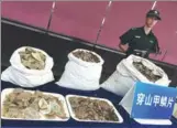  ?? PROVIDED TO CHINA DAILY ?? Customs authoritie­s display seized pangolin scales in Guangzhou, Guangdong province.