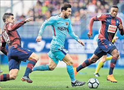  ?? GETTY IMAGES ?? ▪ Barcelona’s Lionel Messi (centre) duels for the ball with two Eibar players during their La Liga match in Eibar, Spain on Saturday.