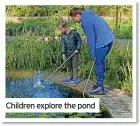  ?? ?? Children explore the pond