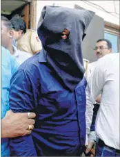  ??  ?? Iqbal Kaskar, brother of underworld don Dawood Ibrahim, being produced in court in Mumbai on Wednesday.