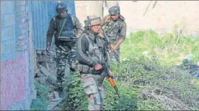  ?? WASEEM ANDRABI / HT ?? Army personnel take positions near the site of a militant attack in Sempora area on the outskirts of Srinagar on Monday.