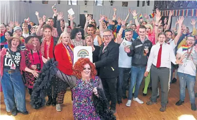  ??  ?? HANDS IN AIR: Christina McKelvie MSP, minister for older people and equalities, and Brendan O’Hara MP, for Argyll and Bute, celebrate the success of Oban Pride with Crystal, front, a member of the organising committee