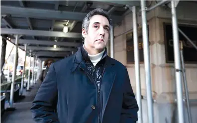  ?? AP PHOTO/RICHARD DREW ?? Michael Cohen, former lawyer to President Donald Trump, leaves his apartment building on New York’s Park Avenue on Friday. In a Justice Department memo released Friday, Cohen claims to have been ordered shortly before the 2016 election by thencandid­ate Donald Trump to make illegal payments to avoid a sex scandal.