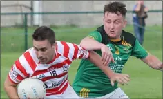  ??  ?? Tomás Hawkins (Ferns) is challenged by Brian Lacey (St. Fintan’s).