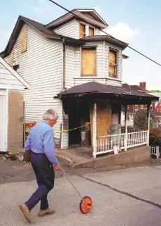  ?? THE MORNING CALL ?? Shown are the burned out remnants of John Hirko’s home, where Bethlehem police threw a flash grenade that started a fire in 1997.