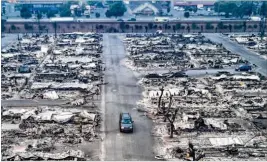  ?? JOSH HANER / THE NEW YORK TIMES ?? This aerial view shows blocks of burned-down homes Tuesday in the Journey’s End Mobile Home Park in Santa Rosa, Calif. Much of the damage from California’s wildfires was in Santa Rosa, a larger city than usually faces a wildfire.