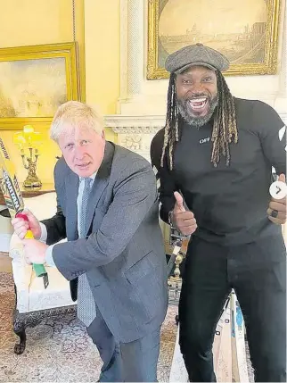 ?? CONTRIBUTE­D ?? British Prime Minister Boris Johnson (left), and Universe Boss Chris Gayle.