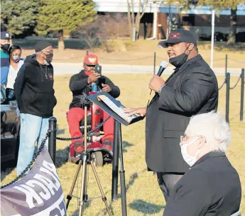  ?? KELLEY SMITH/AP ?? Calling for the resignatio­n of Michigan City Mayor Duane Parry, the Rev. James Lane addresses the crowd during the Rally for Reconcilia­tion near City Hall on Tuesday.