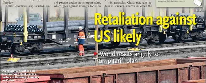  ?? Photo: VCG ?? An employee watches as a train carrying steel leaves a factory in Duisburg, Germany on Friday.